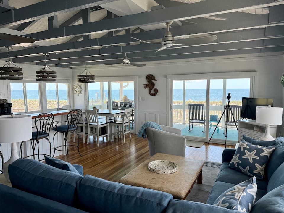 Open living and dining area with ocean views at 10 Steps to the Beach