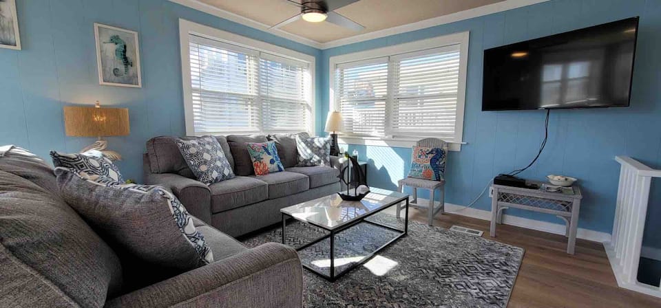 Bright blue living room at 47 Steps to the Beach